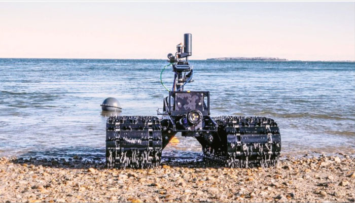 LEON-APFIT-FY25-web The Littoral Explosive Ordinance and Neutralization (LEON) Amphibious Unmanned Ground Vehicle, an FY25 APFIT project, exits the water after clearing surf-zone mines in an exercise.